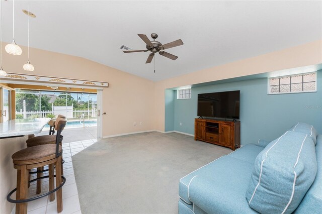 127 Jennifer Dr, Rotonda West, FL 33947 - living area featuring vaulted ceiling, ceiling fan, and light carpet