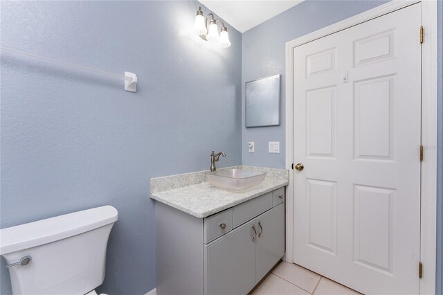 127 Jennifer Dr, Rotonda West, FL 33947 - half bathroom with vanity and tile patterned flooring