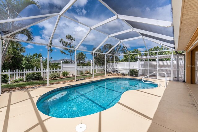 127 Jennifer Dr, Rotonda West, FL 33947 - view of pool featuring a patio area, a fenced backyard, and glass enclosure