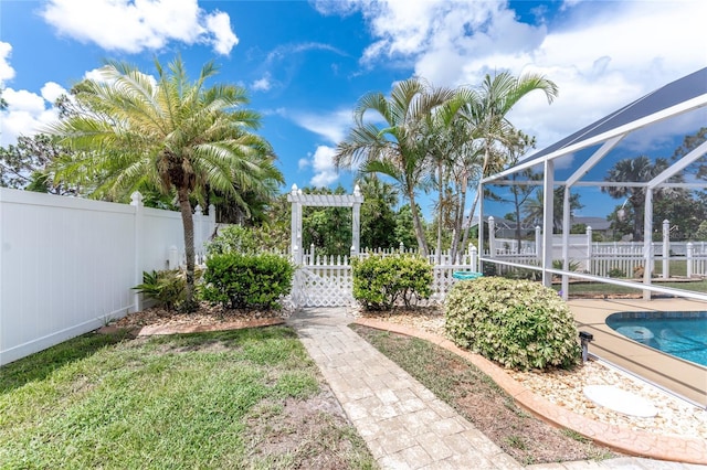 127 Jennifer Dr, Rotonda West, FL 33947 - fenced backyard with a lanai