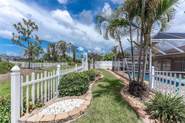 127 Jennifer Dr, Rotonda West, FL 33947 - fenced backyard featuring a lanai