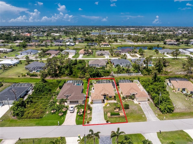 127 Jennifer Dr, Rotonda West, FL 33947 - aerial view of residential area featuring a large body of water and property boundaries highlighted