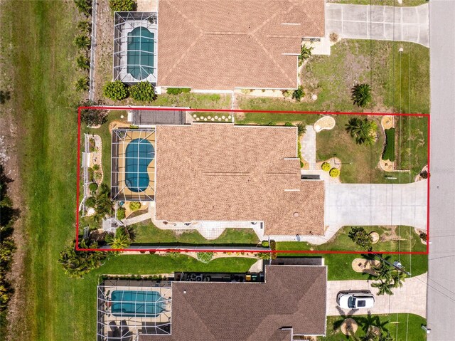 127 Jennifer Dr, Rotonda West, FL 33947 - aerial view of property's location featuring property parcel outlined and a pool