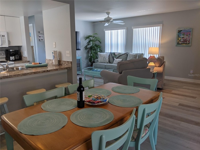 2373 N Beach Rd Unit 1C, Englewood, FL 34223 - dining space featuring wood finished floors and a ceiling fan