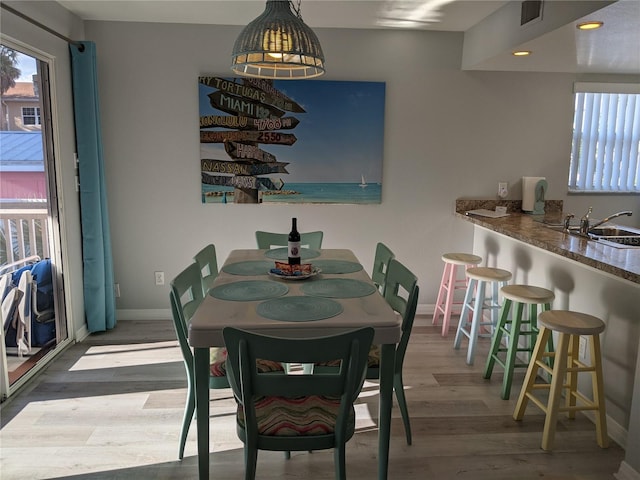 2373 N Beach Rd Unit 1C, Englewood, FL 34223 - dining area with wood finished floors and recessed lighting