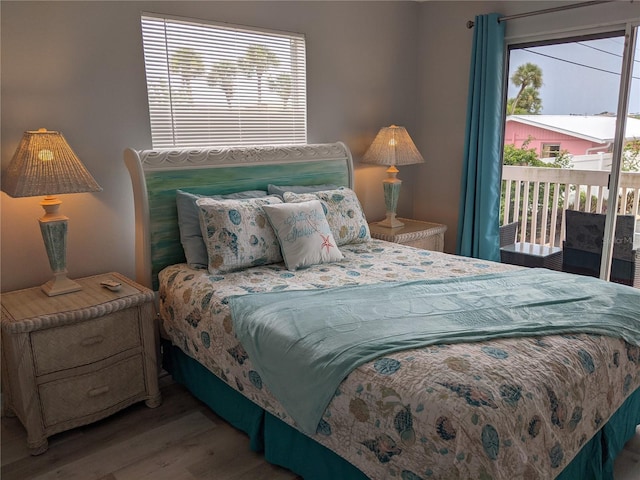 2373 N Beach Rd Unit 1C, Englewood, FL 34223 - bedroom with wood finished floors and access to exterior