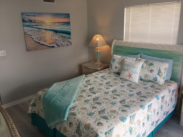 2373 N Beach Rd Unit 1C, Englewood, FL 34223 - bedroom featuring wood finished floors and baseboards