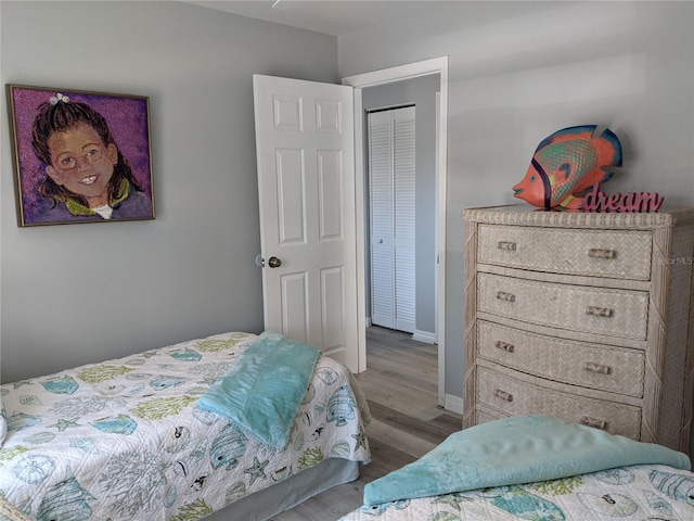 2373 N Beach Rd Unit 1C, Englewood, FL 34223 - bedroom featuring wood finished floors and baseboards