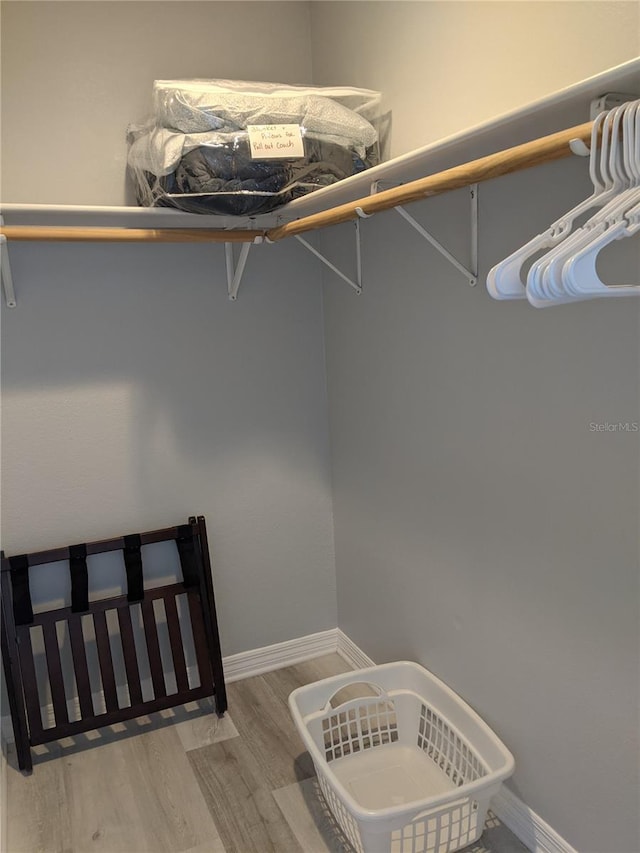 2373 N Beach Rd Unit 1C, Englewood, FL 34223 - walk in closet featuring light wood-style flooring