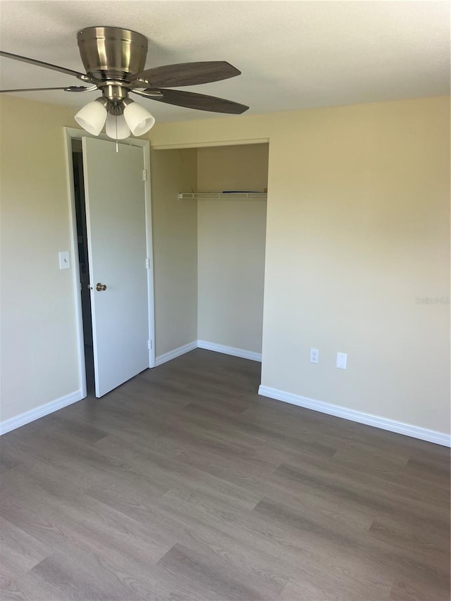11216 Kimberly Ave Unit A & B, Englewood, FL 34224 - unfurnished bedroom with a closet, dark wood-style floors, and ceiling fan