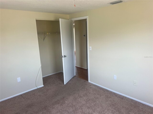 11216 Kimberly Ave Unit A & B, Englewood, FL 34224 - unfurnished bedroom featuring carpet floors and a closet