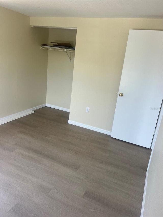 11216 Kimberly Ave Unit A & B, Englewood, FL 34224 - unfurnished bedroom featuring dark wood-style floors and a closet