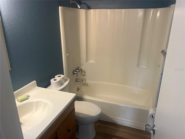 11216 Kimberly Ave Unit A & B, Englewood, FL 34224 - bathroom featuring  shower combination, wood finished floors, vanity, and a textured wall