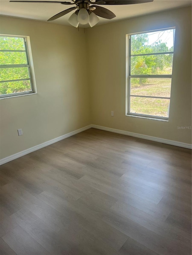 11216 Kimberly Ave Unit A & B, Englewood, FL 34224 - unfurnished room with wood finished floors, ceiling fan, and plenty of natural light
