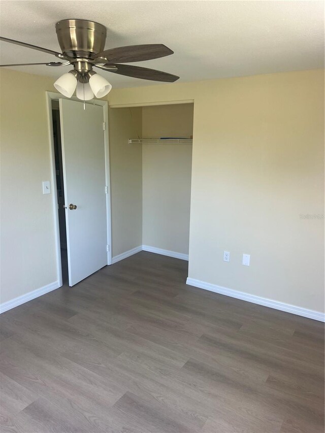 11216 Kimberly Ave Unit A & B, Englewood, FL 34224 - empty room featuring ceiling fan and dark wood-style flooring