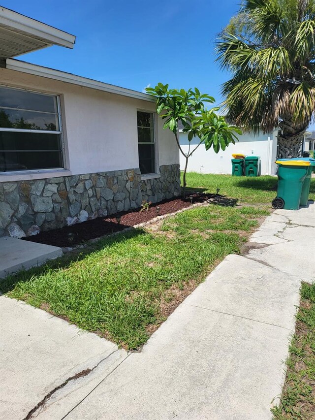 11216 Kimberly Ave Unit A & B, Englewood, FL 34224 - view of property exterior with stone siding and stucco siding