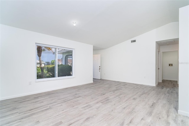 15 Bunker Pl, Rotonda West, FL 33947 - spare room with lofted ceiling and light wood-style flooring