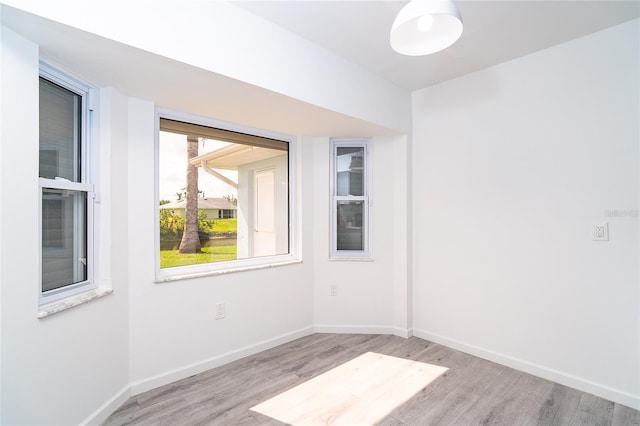 15 Bunker Pl, Rotonda West, FL 33947 - unfurnished room featuring wood finished floors