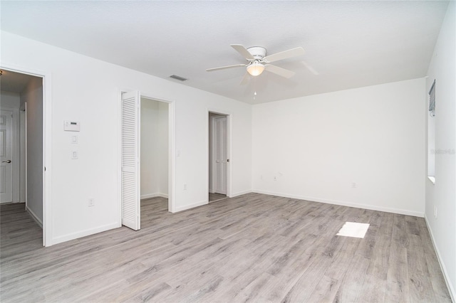 15 Bunker Pl, Rotonda West, FL 33947 - empty room with a ceiling fan and light wood-type flooring