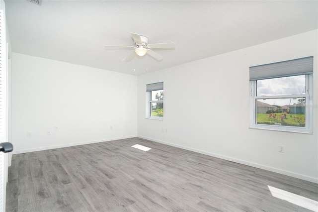 15 Bunker Pl, Rotonda West, FL 33947 - unfurnished room featuring wood finished floors and ceiling fan