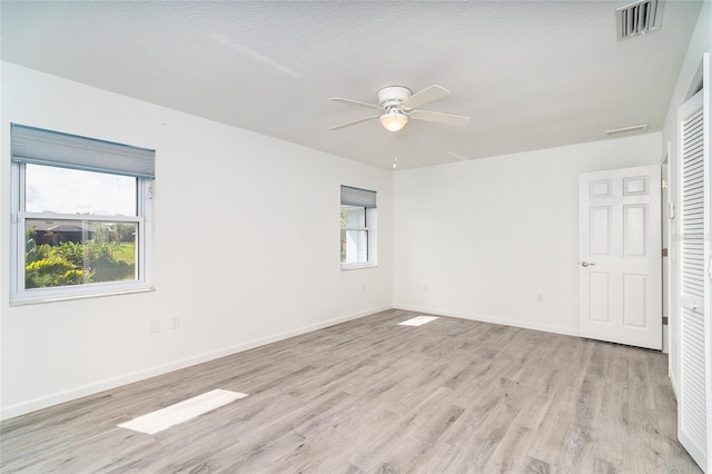 15 Bunker Pl, Rotonda West, FL 33947 - unfurnished room featuring light wood-style flooring and a ceiling fan