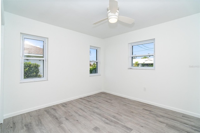 15 Bunker Pl, Rotonda West, FL 33947 - empty room with light wood-type flooring and baseboards