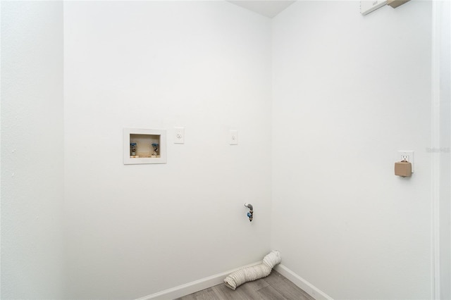 15 Bunker Pl, Rotonda West, FL 33947 - washroom with washer hookup and light wood-type flooring