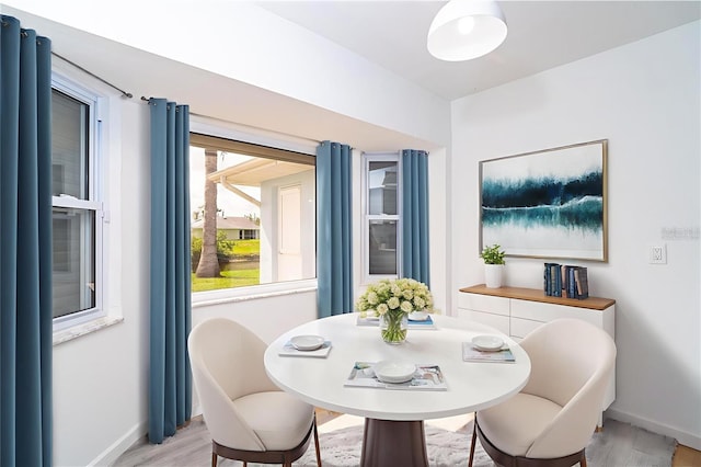15 Bunker Pl, Rotonda West, FL 33947 - dining room with baseboards and light wood finished floors
