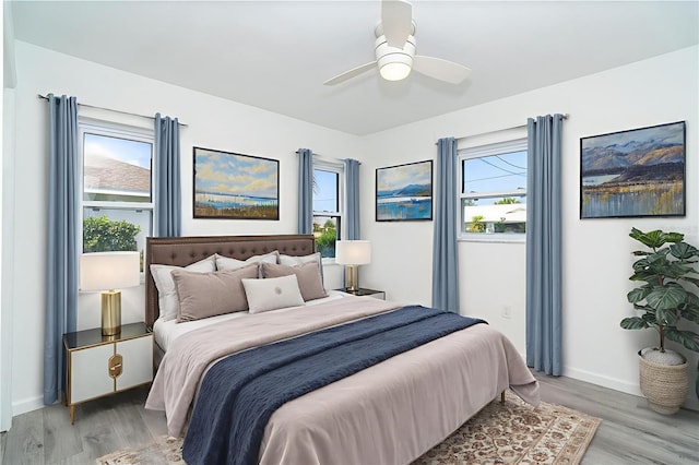 15 Bunker Pl, Rotonda West, FL 33947 - bedroom featuring light wood-style flooring and a ceiling fan