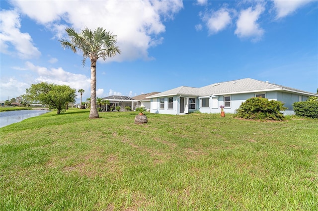 15 Bunker Pl, Rotonda West, FL 33947 - view of green lawn with a water view