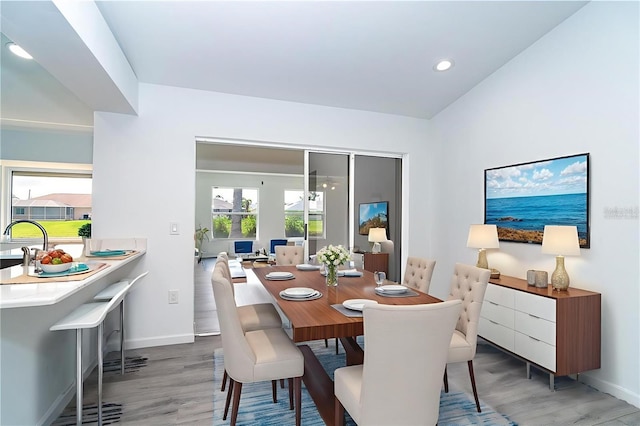 15 Bunker Pl, Rotonda West, FL 33947 - dining space featuring light wood-type flooring and recessed lighting