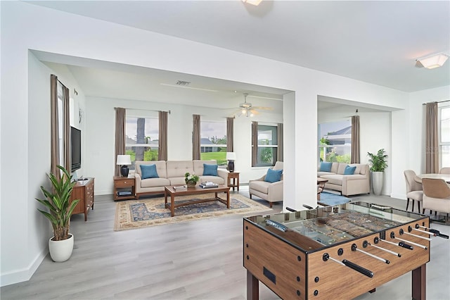 15 Bunker Pl, Rotonda West, FL 33947 - living room featuring ceiling fan and light wood-type flooring