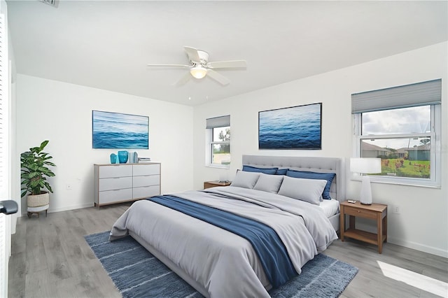 15 Bunker Pl, Rotonda West, FL 33947 - bedroom with light wood-style flooring and a ceiling fan