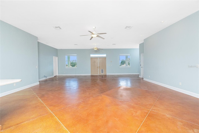 1930 Massachusetts Ave, Englewood, FL 34224 - unfurnished living room featuring finished concrete flooring, healthy amount of natural light, and ceiling fan