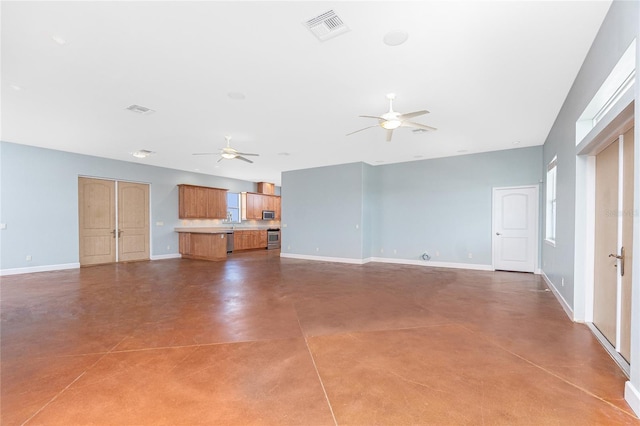 1930 Massachusetts Ave, Englewood, FL 34224 - unfurnished living room featuring ceiling fan and finished concrete floors