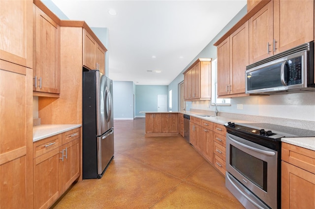 1930 Massachusetts Ave, Englewood, FL 34224 - kitchen with stainless steel appliances, concrete floors, light countertops, a peninsula, and recessed lighting