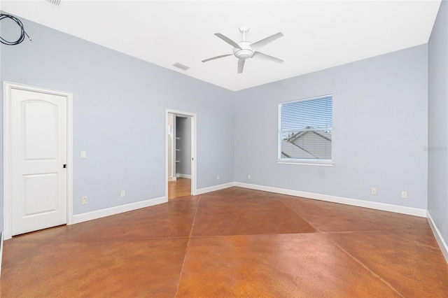 1930 Massachusetts Ave, Englewood, FL 34224 - empty room with concrete floors and a ceiling fan