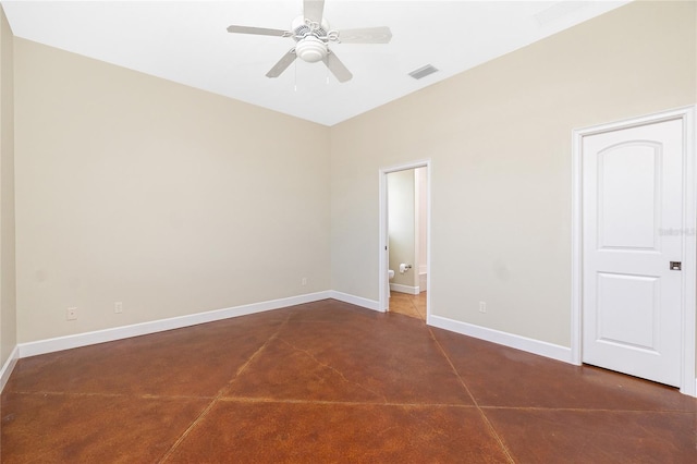 1930 Massachusetts Ave, Englewood, FL 34224 - unfurnished bedroom featuring connected bathroom, a ceiling fan, and concrete flooring