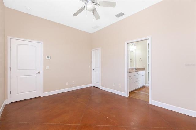 1930 Massachusetts Ave, Englewood, FL 34224 - unfurnished bedroom with concrete flooring, connected bathroom, and ceiling fan