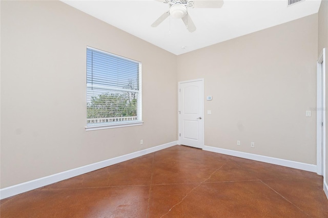 1930 Massachusetts Ave, Englewood, FL 34224 - empty room with finished concrete floors and a ceiling fan