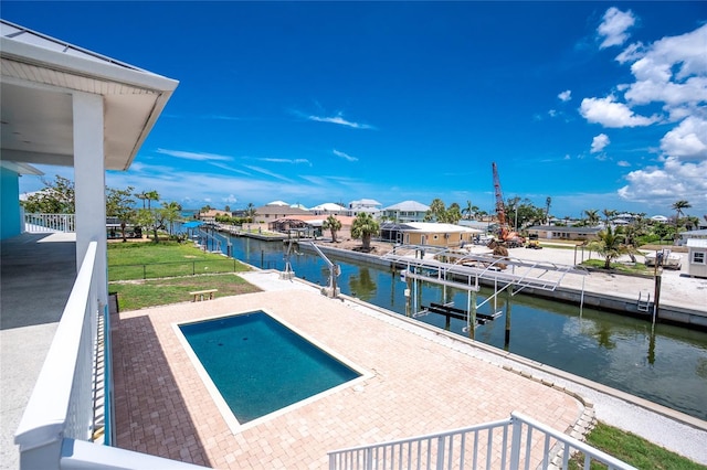 1930 Massachusetts Ave, Englewood, FL 34224 - swimming pool featuring a water view, a residential view, a boat dock, and a patio
