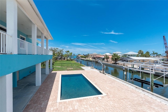 1930 Massachusetts Ave, Englewood, FL 34224 - swimming pool featuring a dock, a water view, and a patio