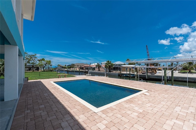 1930 Massachusetts Ave, Englewood, FL 34224 - swimming pool featuring a dock, a water view, a patio, and boat lift