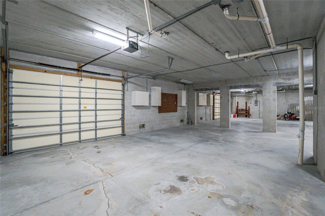 1930 Massachusetts Ave, Englewood, FL 34224 - garage with a garage door opener and concrete block wall
