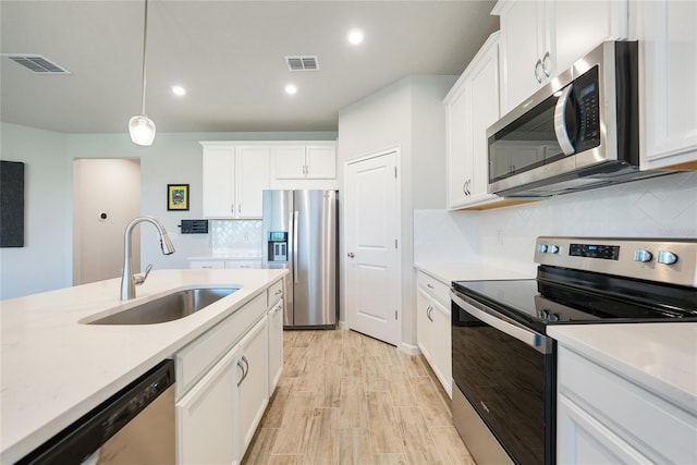17921 Grand Prosperity Dr, Venice, FL 34293 - kitchen with appliances with stainless steel finishes, light countertops, decorative backsplash, and recessed lighting