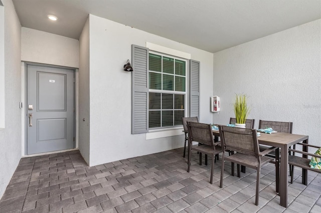 12550 Galapagos Ct Unit 104, Venice, FL 34293 - view of patio with outdoor dining area