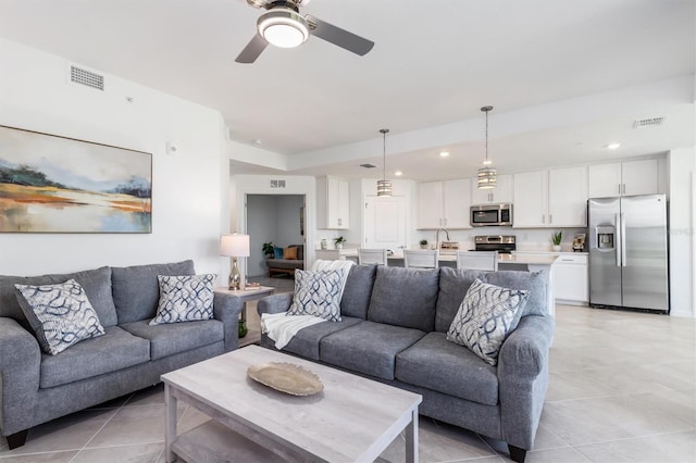 12550 Galapagos Ct Unit 104, Venice, FL 34293 - living room with light tile patterned floors, a ceiling fan, and recessed lighting