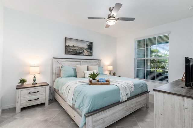12550 Galapagos Ct Unit 104, Venice, FL 34293 - bedroom featuring light tile patterned floors and ceiling fan