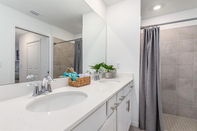 12550 Galapagos Ct Unit 104, Venice, FL 34293 - full bathroom featuring tiled shower and double vanity