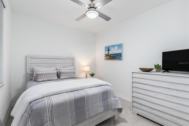 12550 Galapagos Ct Unit 104, Venice, FL 34293 - bedroom with tile patterned floors and a ceiling fan